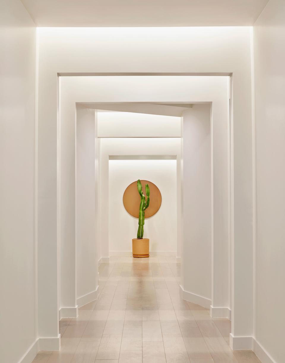 A zen-like hallway leading to exam rooms mimics natural sunlight in order to instill a sense of calm.