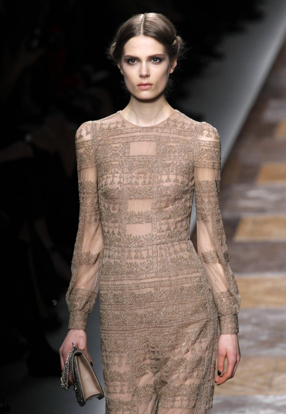 A model wears a creation by Maria Grazia Chiuri and Pier Paolo Piccioli for Valentino as part of the Fall-Winter, ready-to-wear 2013 fashion collection, during Paris Fashion week, Tuesday, March. 6, 2012. (AP Photo/Christophe Ena)