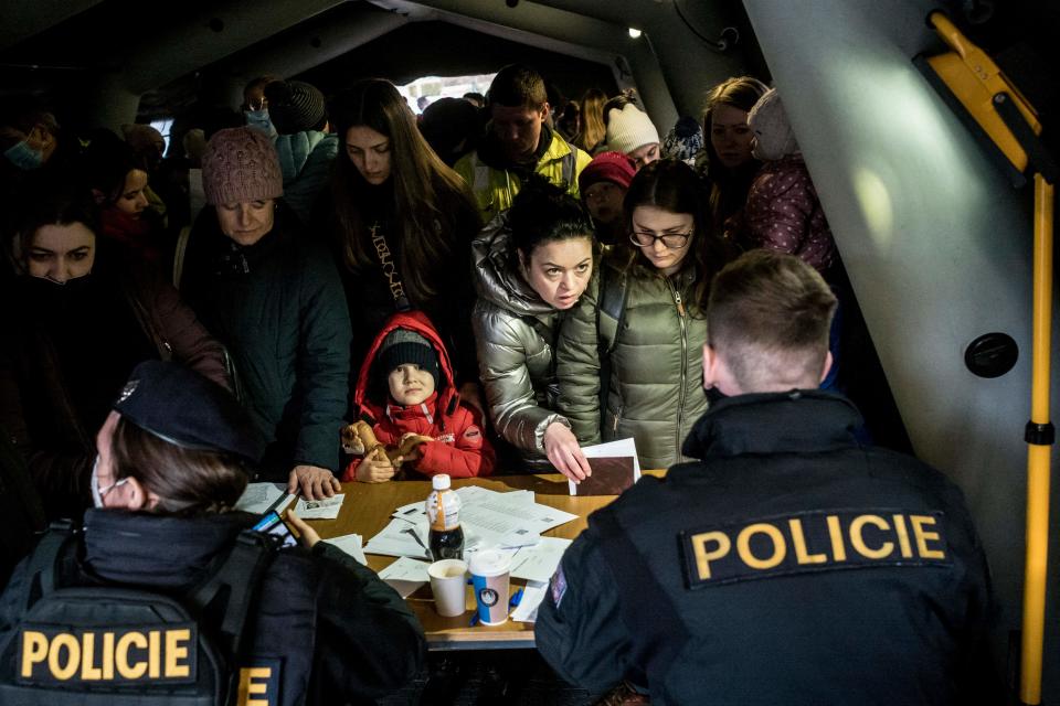 Ukrainian refugees queue to file for residency permits in Prague