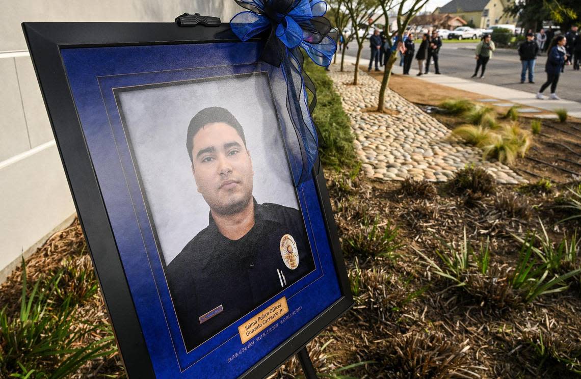 A portrait of fallen Selma Police Officer Gonzalo Carrasco Jr. who was killed in the line of duty one year ago stands outside at the Selma Police Department during a monument dedication for the officer on Wednesday, Jan. 31, 2024.