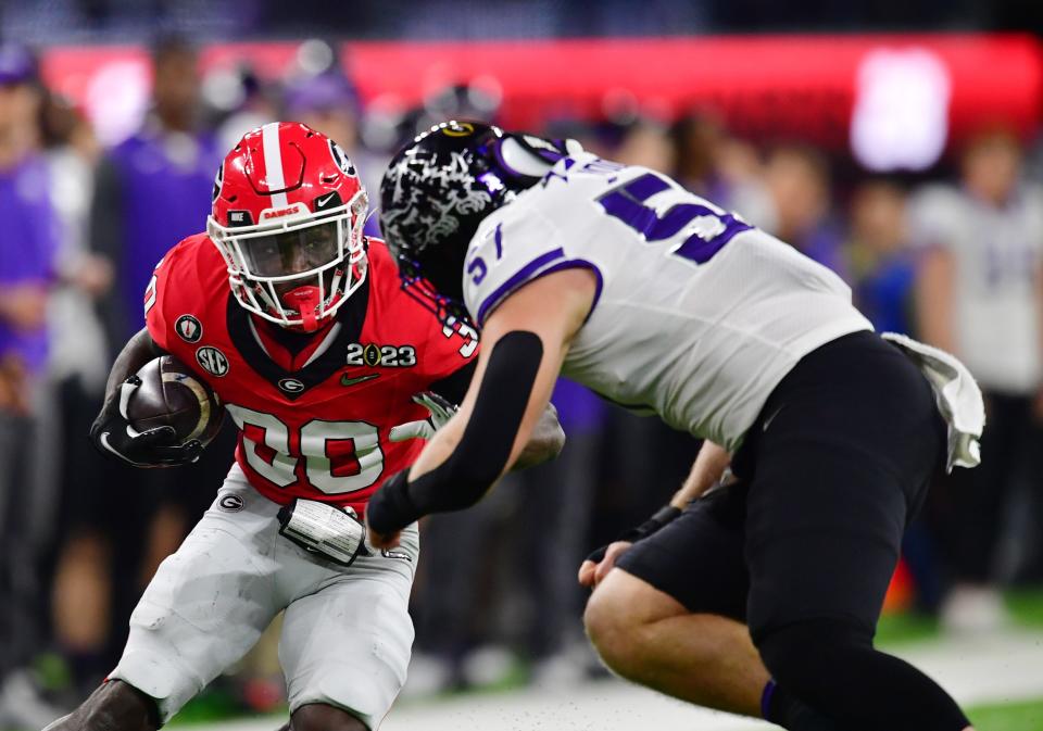 TCU linebacker Johnny Hodges tackles Georgia running back Daijun Edwards during the CFP championship game last season. Hodges was the Big 12 defensive newcomer of the year after leading the Horned Frogs in tackles.