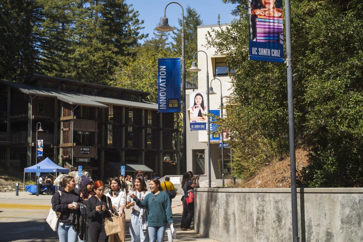 tudents walk through the campus of UC Santa Cruz.