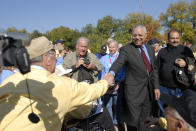 FILE - In this Saturday, Nov. 1, 2008 photo, Gen. Colin L. Powell, former U.S. Secretary of State and Chairman of the Joint Chiefs of Staff, greets veterans from Iowa and Illinois during their visit to the World War II Memorial in Washington, as part of the Inaugural Honor Flight of the Quad Cities. Powell died at the age of 84 on Monday, Oct. 18, 2021, from complications from COVID-19, his family said on Facebook. (Todd Mizener/The Dispatch – The Rock Island Argus via AP)