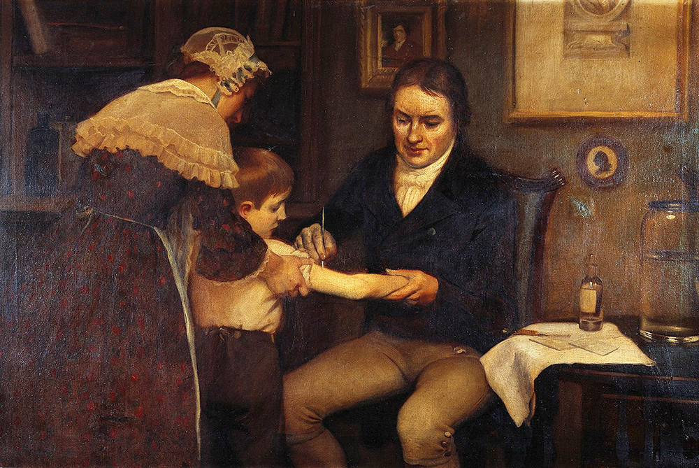 El doctor Jenner realizando sus primeras vacunaciones infantiles en 1796. Oleo de Ernes Board. (Imagen vista en Wikimedia Commons).