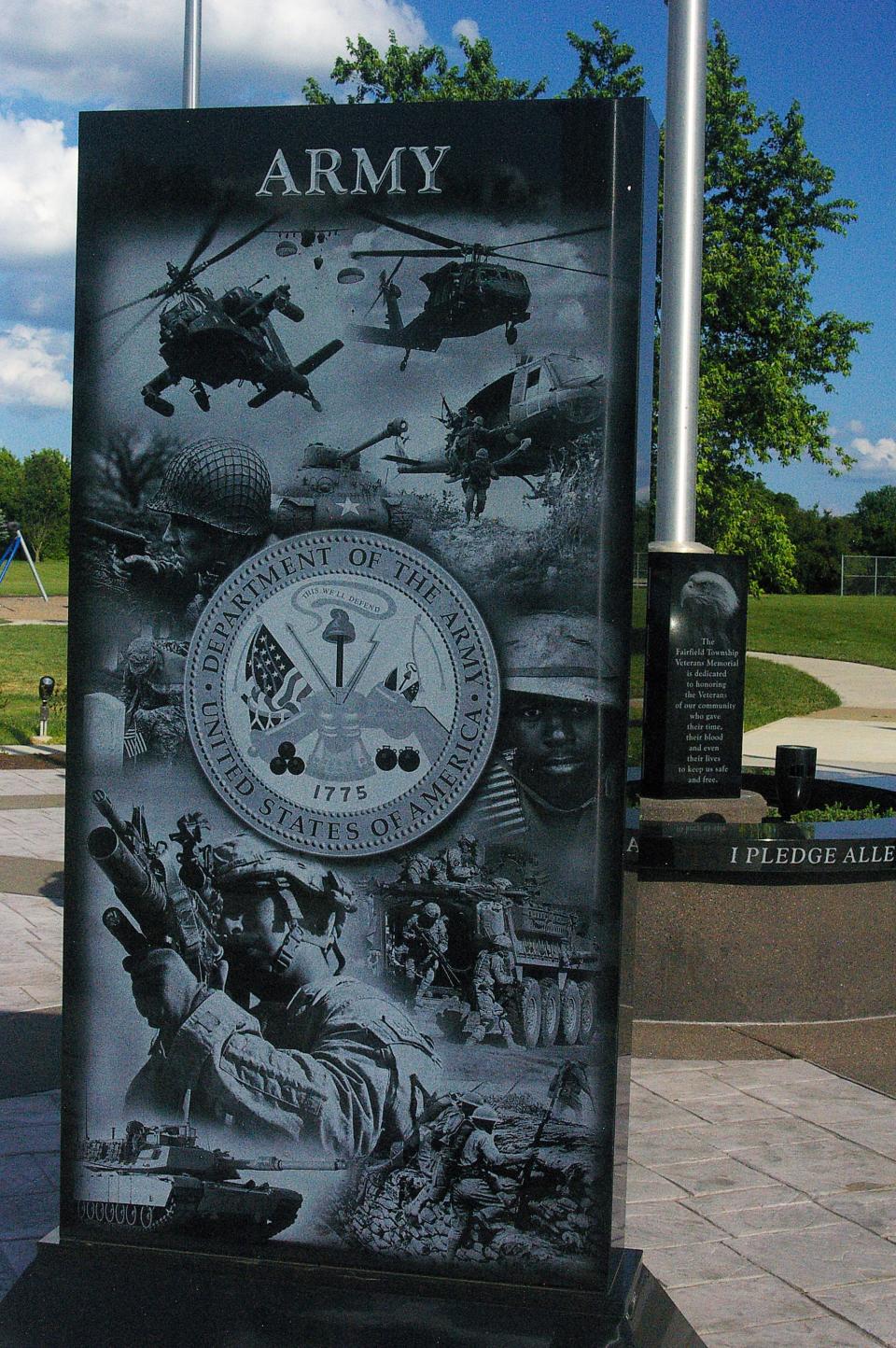 A stone and hexagon granite planter is featured in the circular plaza of the Fairfield Township Veterans Memorial in Heroes Park.