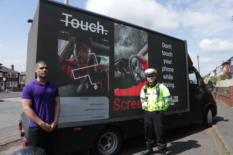 Calvin with GMP Inspector Jamie Buchanan in Swinton -Credit:TfGM/MEN