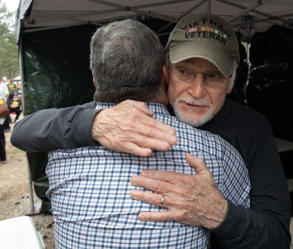 Cecil Roberts, president of the United Mine Workers of America, hugs one of the main speakers during the United Mine Workers of America Caravan at Tannehill State Park Wednesday April 6, 2022. The rally marked the one-year anniversary of the beginning of the strike against Warrior Met Coal.