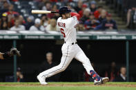 Cleveland Guardians' Owen Miller hits a two-run home run against the Cincinnati Reds during the ninth inning of a baseball game Tuesday, May 17, 2022, in Cleveland. (AP Photo/Ron Schwane)