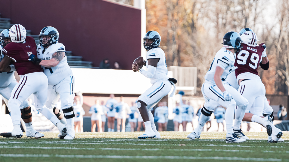 URI quarterback Kasim Hill drops back to pass during Saturday's game against UMass. Hill accounted for four total touchdowns — two passing, two rushing, in the Rams' 35-22 victory.