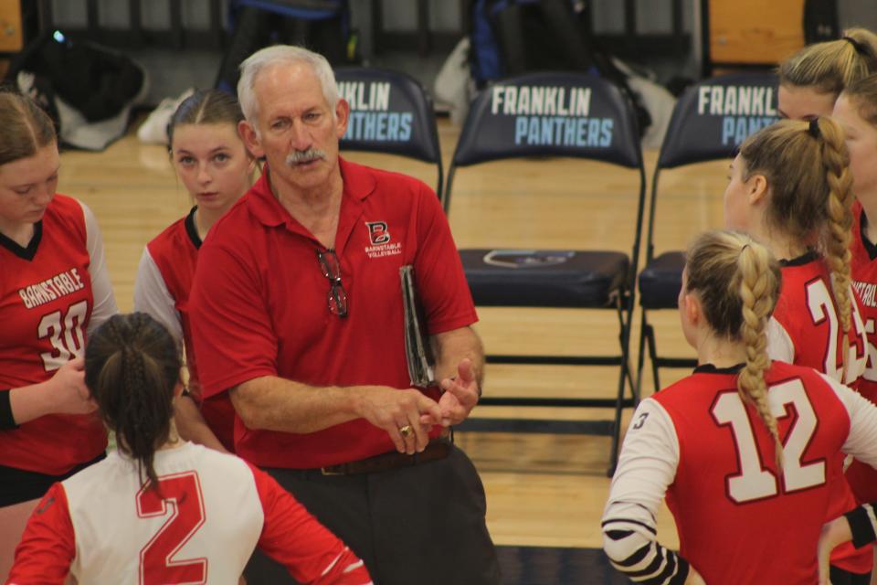 Barnstable girls volleyball head coach Tom Turco talks to his team during a timeout during playoff matchup with Franklin in Round of 8.