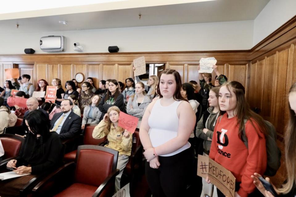 High school students wait in a House Finance Committee meeting to ask lawmakers who voted to uphold Gov. Mike Dunleavy's education veto why they did so on April 4, 2024. (Photo by Claire Stremple/Alaska Beacon)