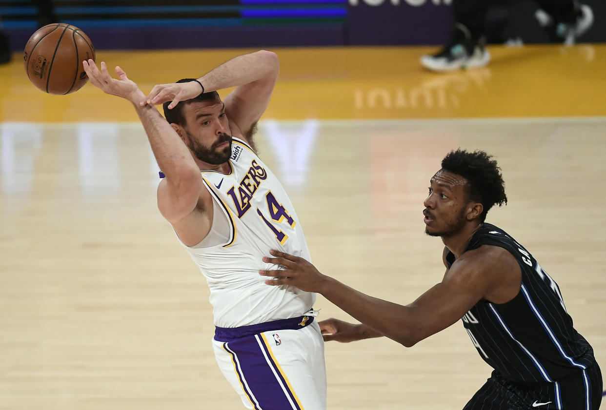 LOS ANGELES, CA - MARCH 28: Marc Gasol #14 of the Los Angeles Lakers loses control of the ball against Wendell Carter Jr. #34 of the Orlando Magic during the first half of the game at Staples Center on March 28, 2021 in Los Angeles, California. NOTE TO USER: User expressly acknowledges and agrees that, by downloading and or using this photograph, User is consenting to the terms and conditions of the Getty Images License Agreement. (Photo by Kevork Djansezian/Getty Images)