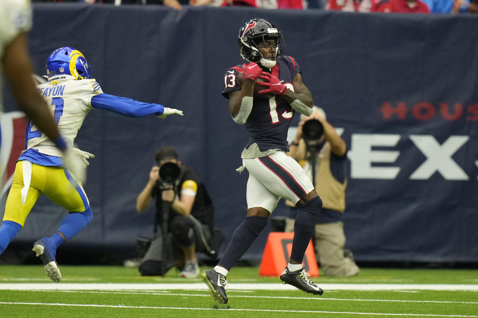 Houston Texans wide receiver Brandin Cooks (13) catches a pass in front of Los Angeles Rams cornerback Donte' Deayon (21) for a touchdown during the second half of an NFL football game, Sunday, Oct. 31, 2021, in Houston. (AP Photo/Eric Smith)