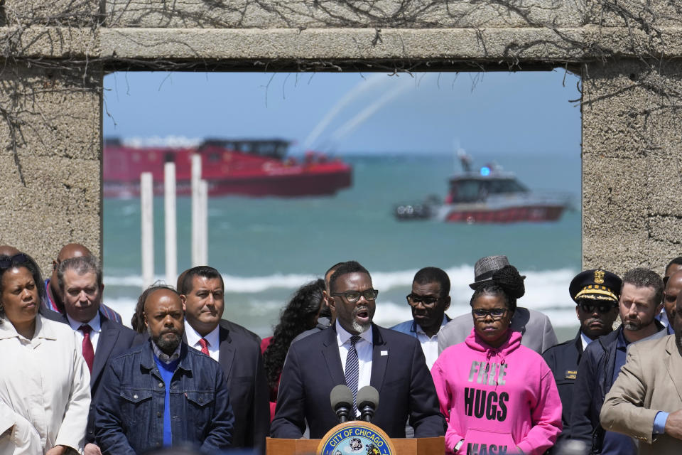 Flanked by city officials and community leaders, Chicago mayor Brandon Johnson announces the city's public safety plan in advance of Memorial Day weekend.Thursday, May 25, 2023, in Chicago. Chicago is heading into the Memorial Day weekend hoping to head off violence that tends to surge with rising temperatures of summer. Even the state of Illinois is assisting by sending in what it's called "peacekeepers" in an attempt to deescalate violent situations. (AP Photo/Charles Rex Arbogast)