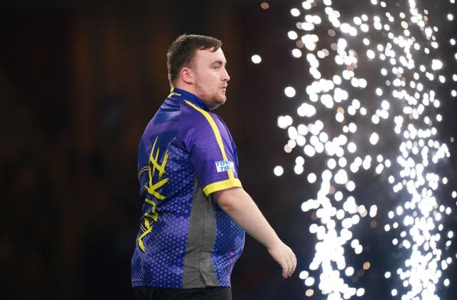 Pyrotechnics go off as Luke Littler celebrates his win over Rob Cross