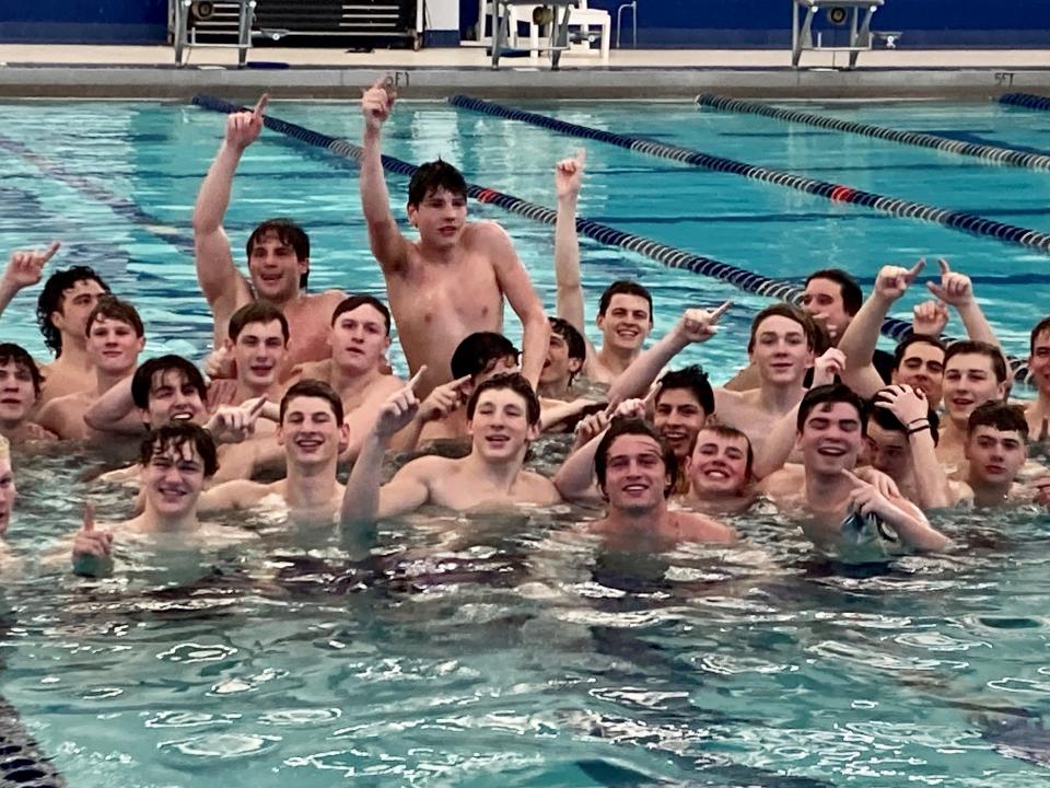 St. Augustine celebrates after defeating Christian Brothers, 91-79, in the NJSIAA Non-Public A swimming final on Feb. 26, 2023.