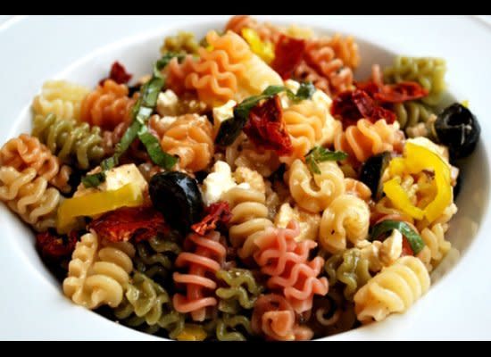 Get the <a href="http://www.dreamydish.com/mediterranean-pasta-salad" target="_hplink">Mediterranean Pasta Salad recipe from Dreamy Dish</a>    Tricolor pasta makes this salad look all the more festive. Packed with sun-dried tomatoes, olives, feta and fresh herbs, it's truly Mediterranean.