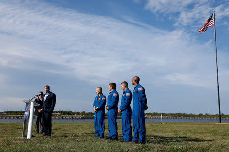 NASA Administrator Jim Bridenstine speaks as NASA commercial crew astronauts Doug Hurley, Bob Behnken, Mike Hopkins and Victor Glover listen before the launch of a SpaceX Falcon 9 carrying the Crew Dragon spacecraft on an uncrewed test flight to the International Space Station from the Kennedy Space Center in Cape Canaveral, Florida, U.S., March 1, 2019. REUTERS/Mike Blake