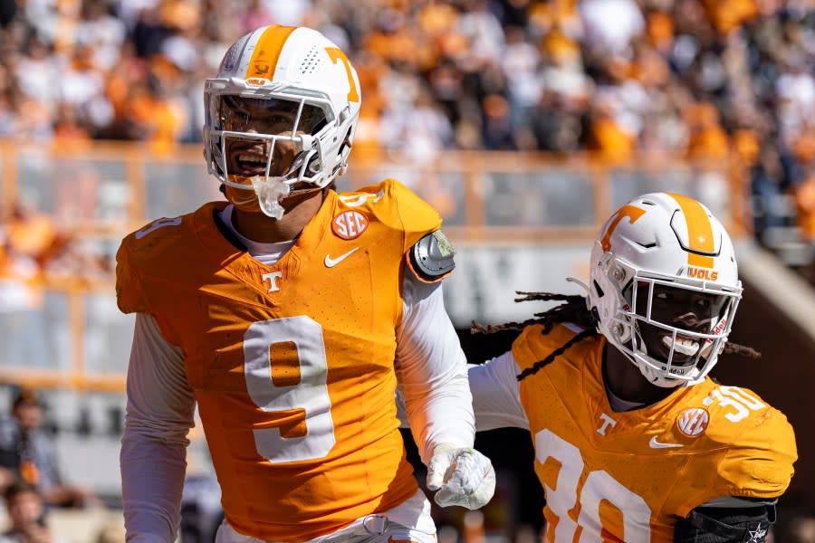 Tennessee defensive lineman Tyler Baron (9) celebrates a fumble recovery for a touchdown during the first half of an NCAA college football game against UConn, Saturday, Nov. 4, 2023, in Knoxville, Tenn. (AP Photo/Wade Payne)