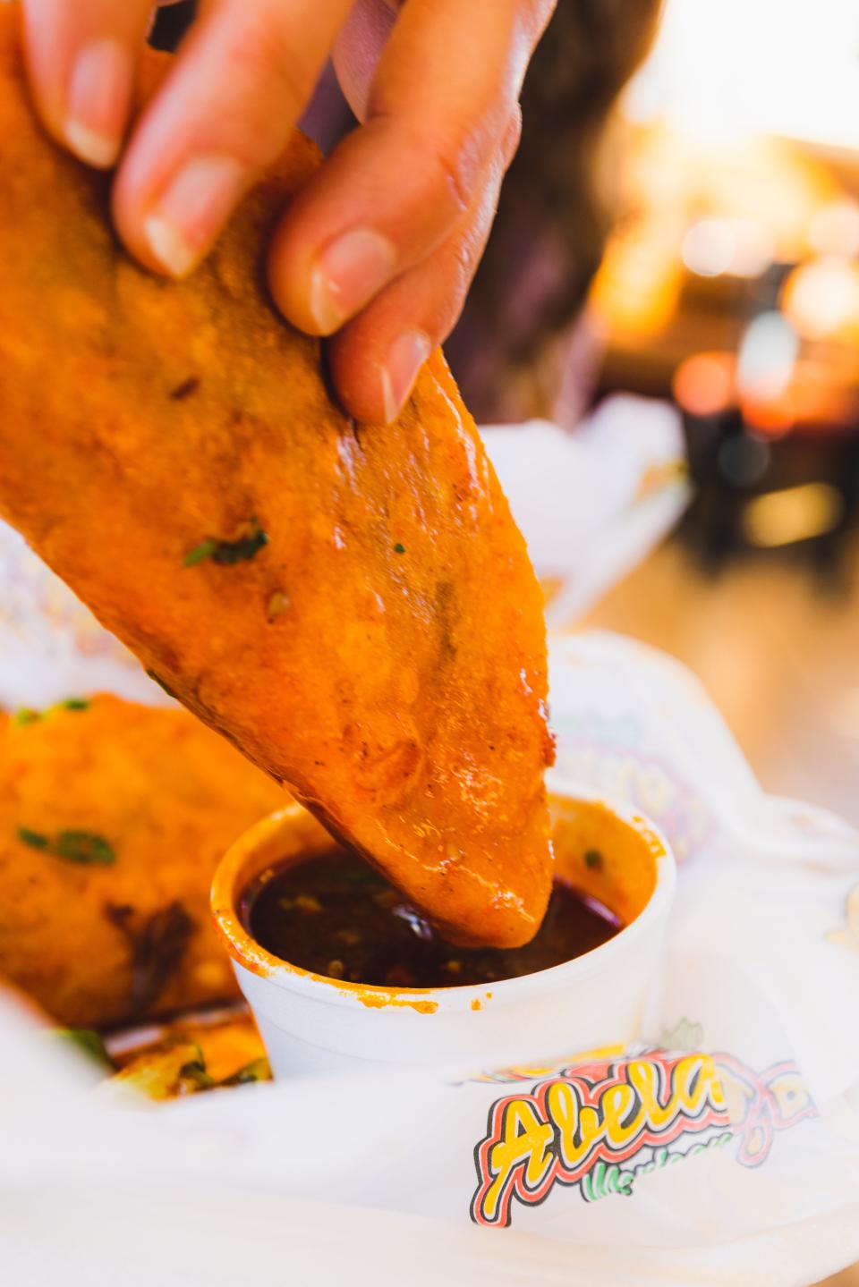 Abelardo’s birria tacos with dipping sauce.