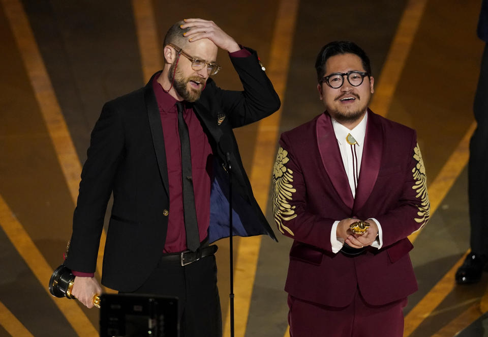 Daniel Scheinert, left, and Daniel Kwan accept the award for best director for "Everything Everywhere All at Once" at the Oscars on Sunday, March 12, 2023, at the Dolby Theatre in Los Angeles. (AP Photo/Chris Pizzello)