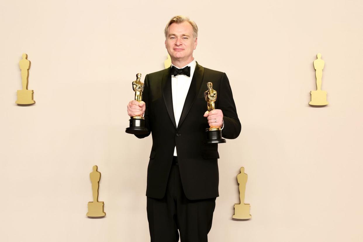 christopher nolan with his oscar awards for best director and best picture for oppenheimer