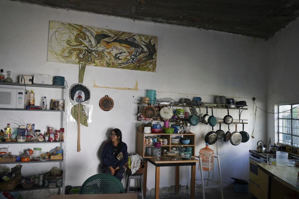 Artist Luz Asturizaga takes a break at the Siqueiros School in Poxindeje, Mexico, Saturday, July 30, 2022. The school is based in a converted elementary school, and one of its co-founders is Jesús Rodríguez Arévalo, a pupil of disciples of Mexico’s three muralism masters: Diego Rivera, David Alfaro Siqueiros and José Clemente Orozco. Asturizaga, a 36-year-old sculptor from Bolivia, says she has enjoyed every moment of her stay in the iconic home of muralism. (AP Photo/Fernando Llano)