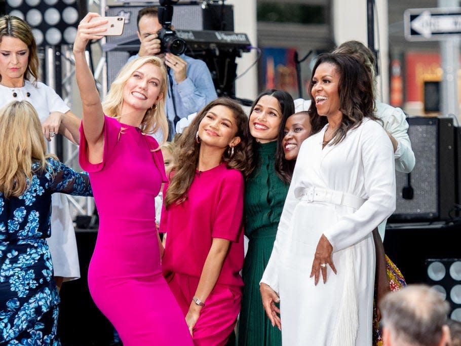 Karlie Kloss takes a selfie with Michelle Obama