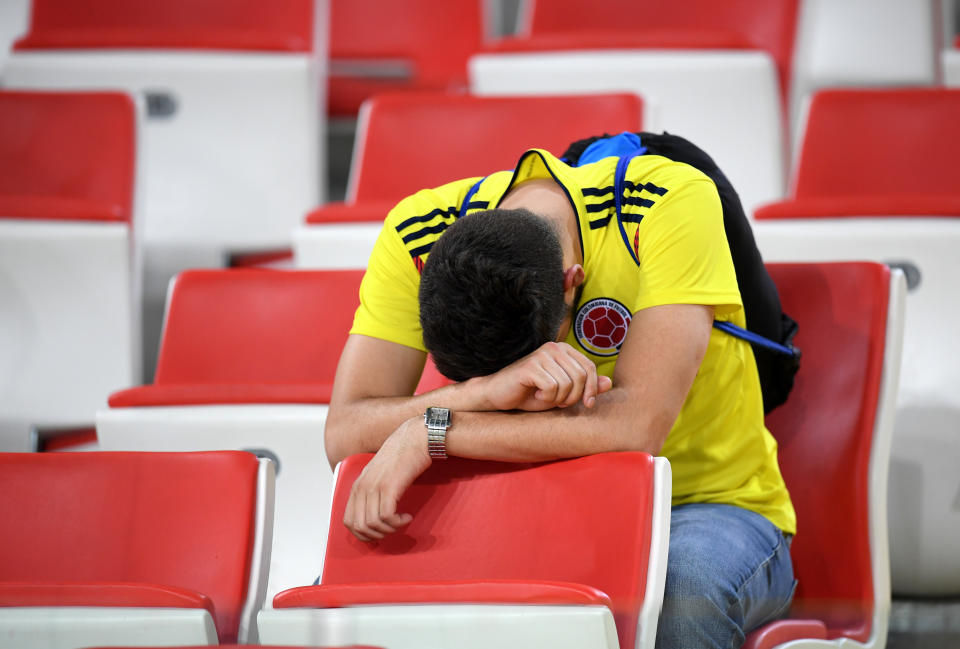 <p>A Colombia fan looks dejected following his sides defeat in the 2018 FIFA World Cup Russia Round of 16 match between Colombia and England at Spartak Stadium on July 3, 2018 in Moscow, Russia. (Photo by Matthias Hangst/Getty Images) </p>