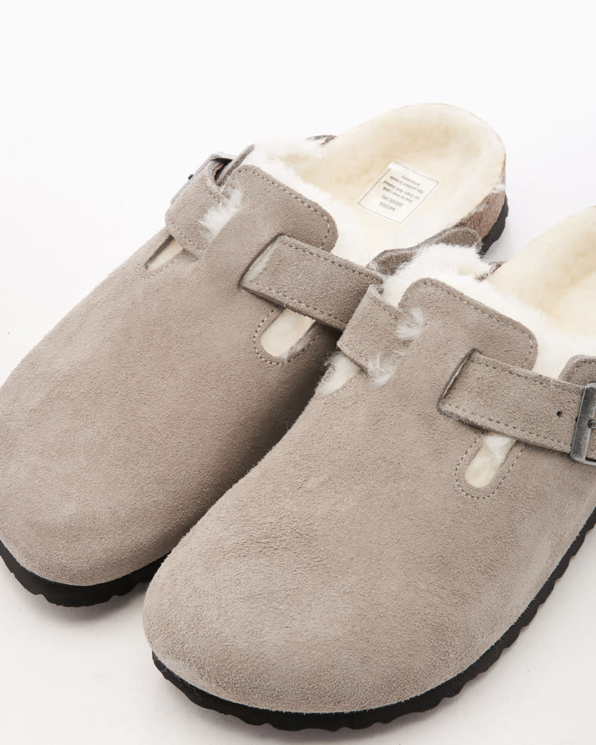 Kick back in these furry mules in one of six colours: taupe, caramel brown, dark brown, black, white, or hot pink.