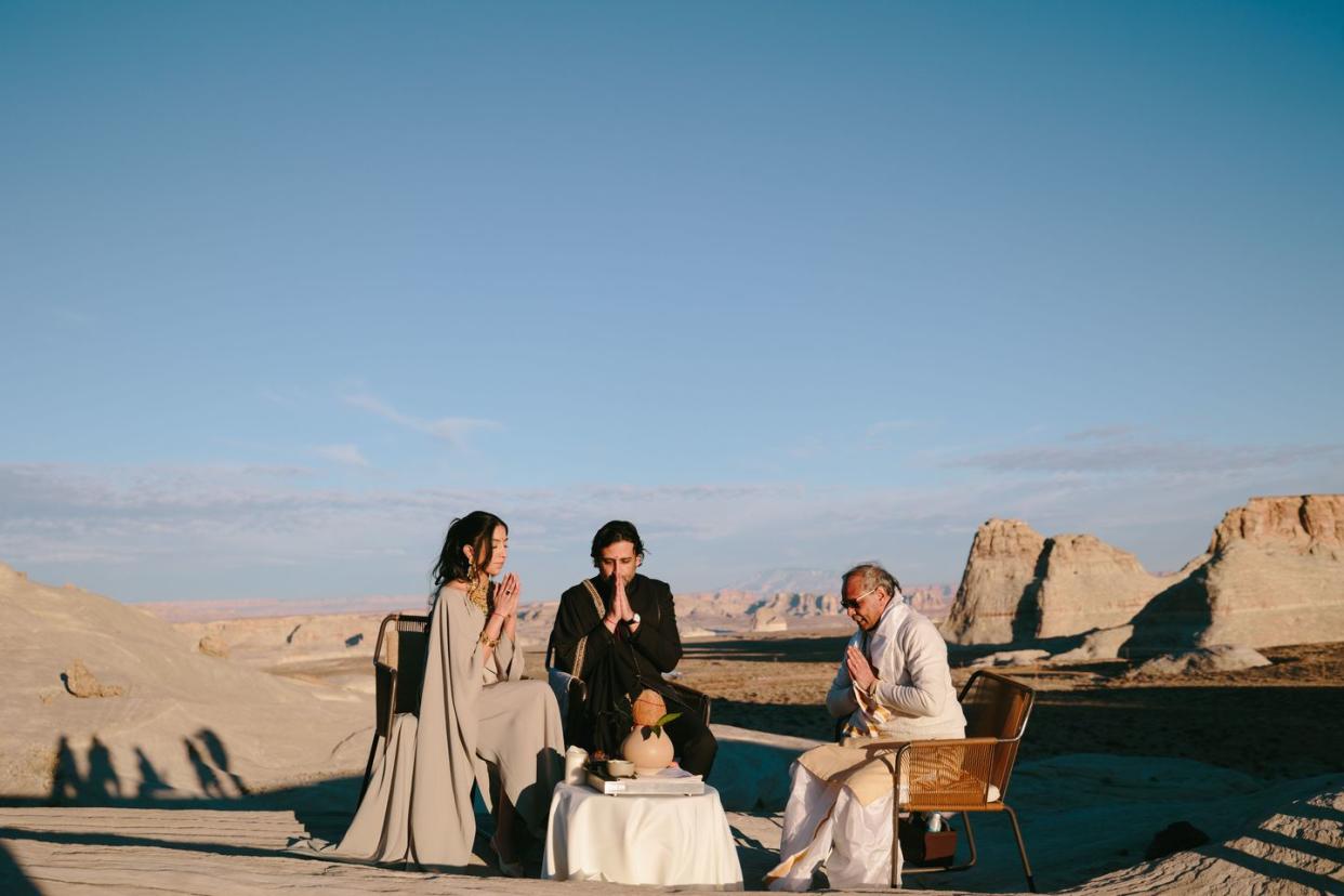 a group of people sitting on a beach