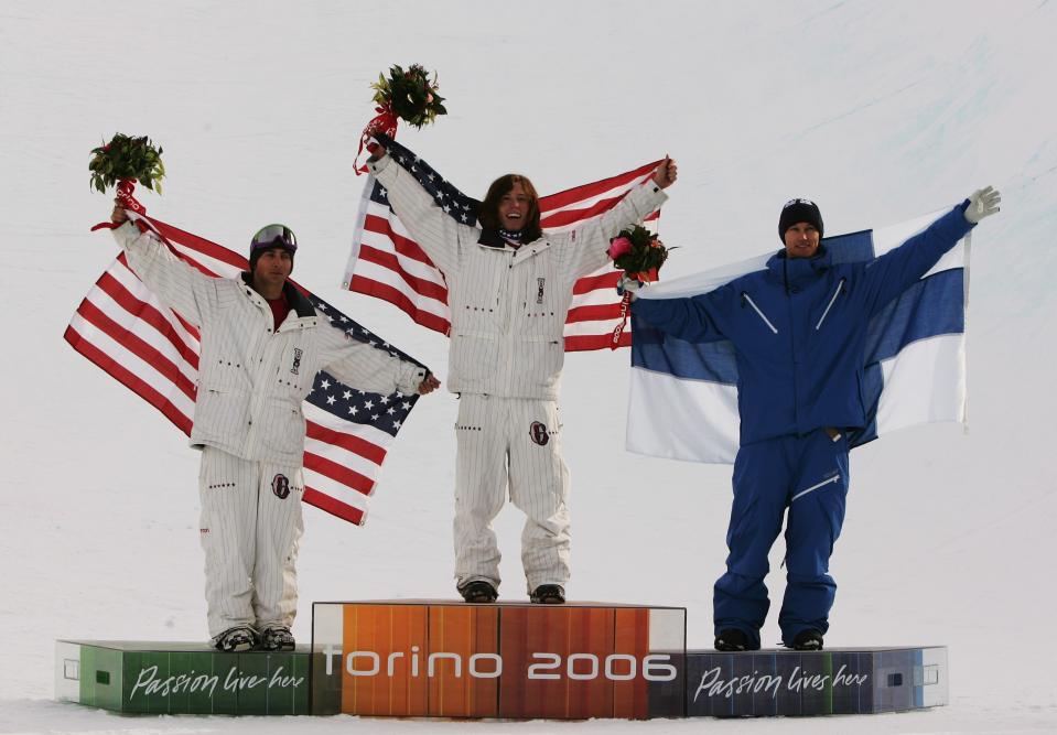 Shaun White (C) celebrates after winning the Gold Medal with teammate Daniel Kass (L) and Markku Koski of Finland in the Mens Snowboard Half Pipe Final at the 2006 Turin Winter Olympic Games in Bardonecchia, Italy. Adam Pretty—Getty Images