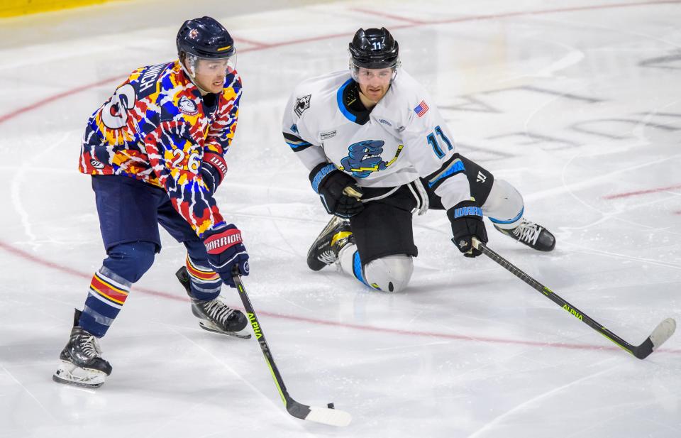 Peoria's Jack Jaunich, left, moves the puck against Quad City's Gianni Vitali in the third period Friday, March 24, 2023 at Carver Arena. The Rivermen fell to the Storm 1-0.