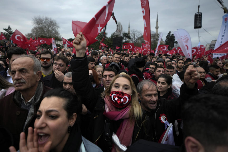 FILE - Supporters of Istanbul Mayor Ekrem Imamoglu chant slogans as they gather in front of the municipal building in Istanbul, Thursday, Dec. 15, 2022. (AP Photo/Khalil Hamra, File)