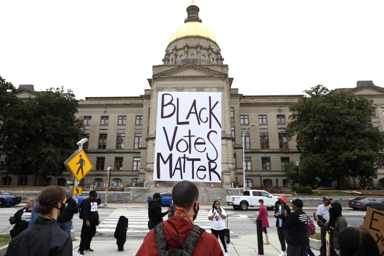 Demonstrators protest a sweeping elections bill to place greater restriction on voting in Georgia, one of more than 40 states where Republicans are proposing new restrictions on voting rights following 2020 elections. (REUTERS)