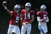 Carolina Panthers' Matt Corral passes as Sam Darnold and Baker Mayfield look on during the NFL football team's training camp at Wofford College on Tuesday, Aug. 2, 2022, in Spartanburg, S.C. (AP Photo/Chris Carlson)
