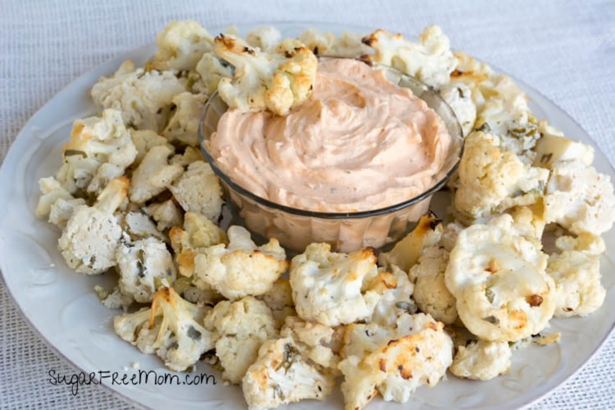 <p>Sugar Free Mom</p><p>These ranch cauliflower bites will fly off the table at your next BBQ!</p><p><a href="http://www.sugarfreemom.com/recipes/oven-fried-ranch-cauliflower-bites-with-deans-buffalo-ranch-dip/" rel="nofollow noopener" target="_blank" data-ylk="slk:Get the recipe!;elm:context_link;itc:0;sec:content-canvas" class="link rapid-noclick-resp">Get the recipe!</a></p>