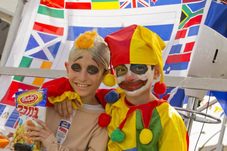 Dressed up Israeli children pose as they take part in a parade to celebrate the Jewish holiday of Purim on February 24, 2013 in the central Israeli city of Netanya. (Jack Guez/AFP/Getty Images)