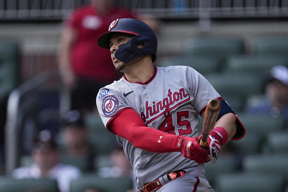 Washington Nationals designated hitter Joey Meneses (45) drives in a run with a double in the first inning of a baseball game against the Atlanta Braves, Sunday, Oct. 1, 2023, in Atlanta. (AP Photo/John Bazemore)