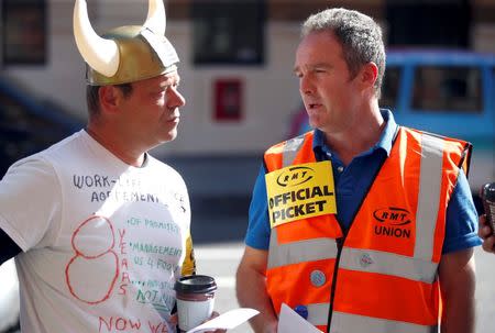 Striking Eurostar workers stands on a picket line outside St. Pancras train station in London, Britain August 12, 2016. REUTERS/Peter Nicholls