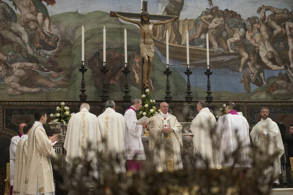 Pope Francis leads a mass where 32 babies were baptized in the Sistine Chapel at the Vatican