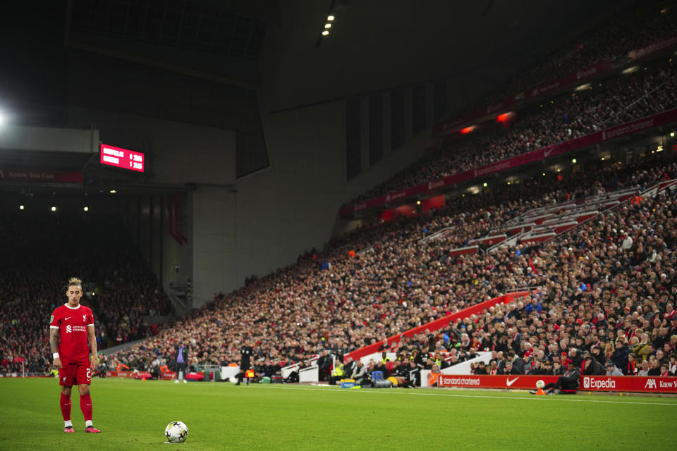 Liverpool's Kostas Tsimikas prepares to play a free kick during the English League Cup third round soccer match between Liverpool and Leicester City at the Anfield stadium in Liverpool, England, Wednesday, Sept. 27, 2023. (AP Photo/Jon Super)