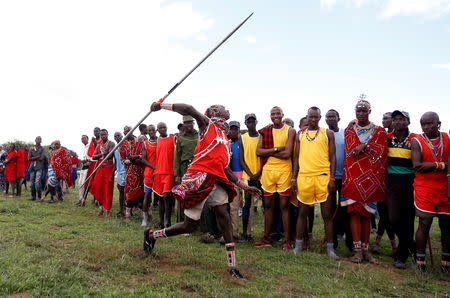 A Maasai Moran from Mbirikani Manyatta, throws a javelin as he competes in the 2018 Maasai Olympics at the Sidai Oleng Wildlife Sanctuary, at the base of Mt. Kilimanjaro, near the Kenya-Tanzania border in Kimana, Kajiado, Kenya December 15, 2018. REUTERS/Thomas Mukoya