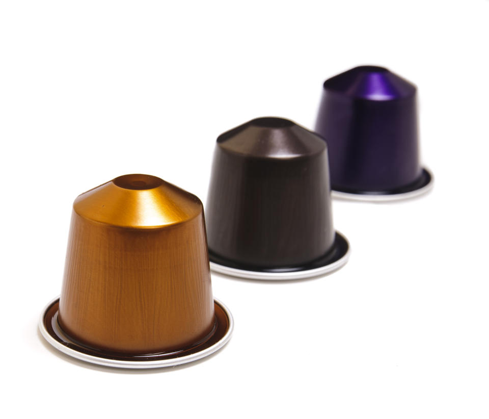 "Istanbul, Turkey - April 15, 2011: Nespresso coffee capsules with different colors isolated on white. Nespresso is an operating unit of the NestlA Group based in Switzerland."