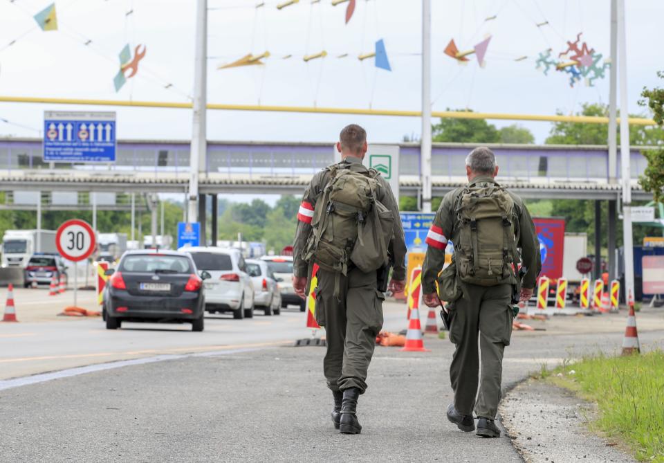 Austrian soldiers patrol at the Austrian-Slovenian border at the checkpoint near Spielfeld, Austria, on June 5, 2020. - Austria scrapped entry checks at its land borders introduced because of the coronavirus pandemic, except those at the frontier with Italy. Slovenia reciprocated the reopening from Friday, June 5, 2020 and lets in people travelling from Austria without checks. (Photo by ERWIN SCHERIAU / APA / AFP) / Austria OUT (Photo by ERWIN SCHERIAU/APA/AFP via Getty Images)