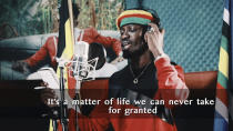 This image made from video is a frame from the latest music video of Bobi Wine, whose real name is Kyagulanyi Ssentamu, showing the singer recording an informational music video educating the public about the dangers of the new coronavirus and the precautionary measures they should take to fight its spread. Wine, who released a song in March 2020 urging Africa's people to wash their hands to stop the spread of the new coronavirus, is criticizing African governments for not maintaining better health care systems for the continent's 1.3 billion people while investing in weapons and "curtailing the voices of the people". (Bobi Wine via AP)