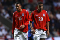 England's Jermaine Jenas (l) and Kieron Dyer (r) leave the pitch after the match (Photo by Neal Simpson/EMPICS via Getty Images)