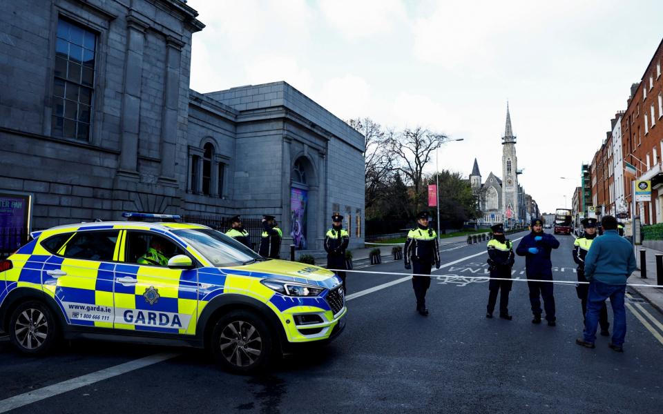 Police tape and officers remain at the scene of the stabbing