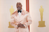 Dwayne Johnson arrives at the Oscars on Sunday, March 12, 2023, at the Dolby Theatre in Los Angeles. (AP Photo/Ashley Landis)