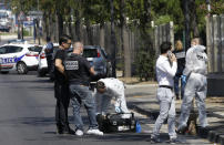 <p>French police officers work near a bus stop in La Valentine district after a van rammed into two bus stops in the French port city of Marseille, southern France, Aug. 21, 2017. (Photo: Claude Paris/AP) </p>